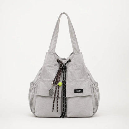 Carryall – Convertible Drawstring Canvas Tote Backpack with Cargo Pockets